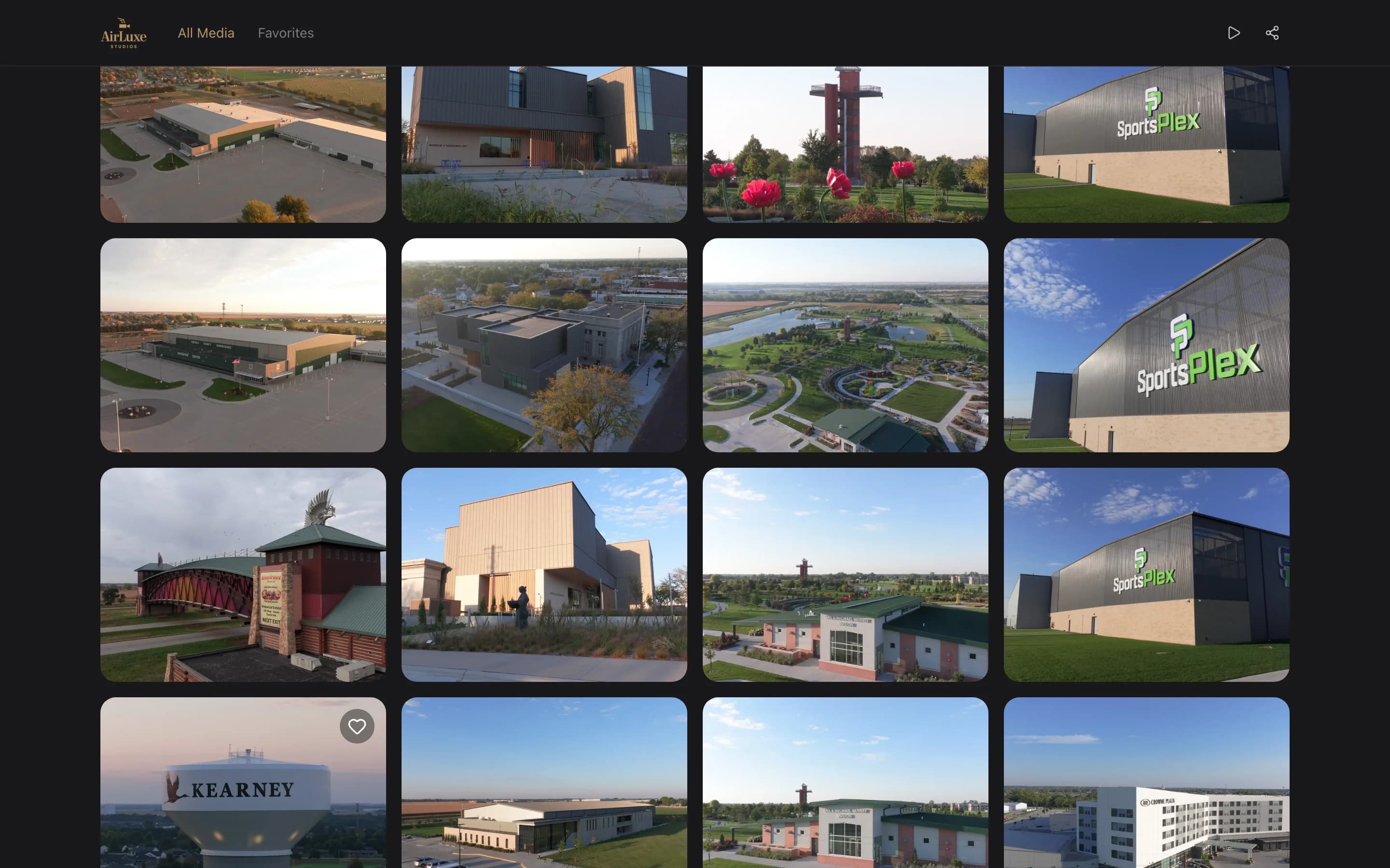 A dark branded client gallery showing a grid of aerial photographs with the studio's logo in the corner